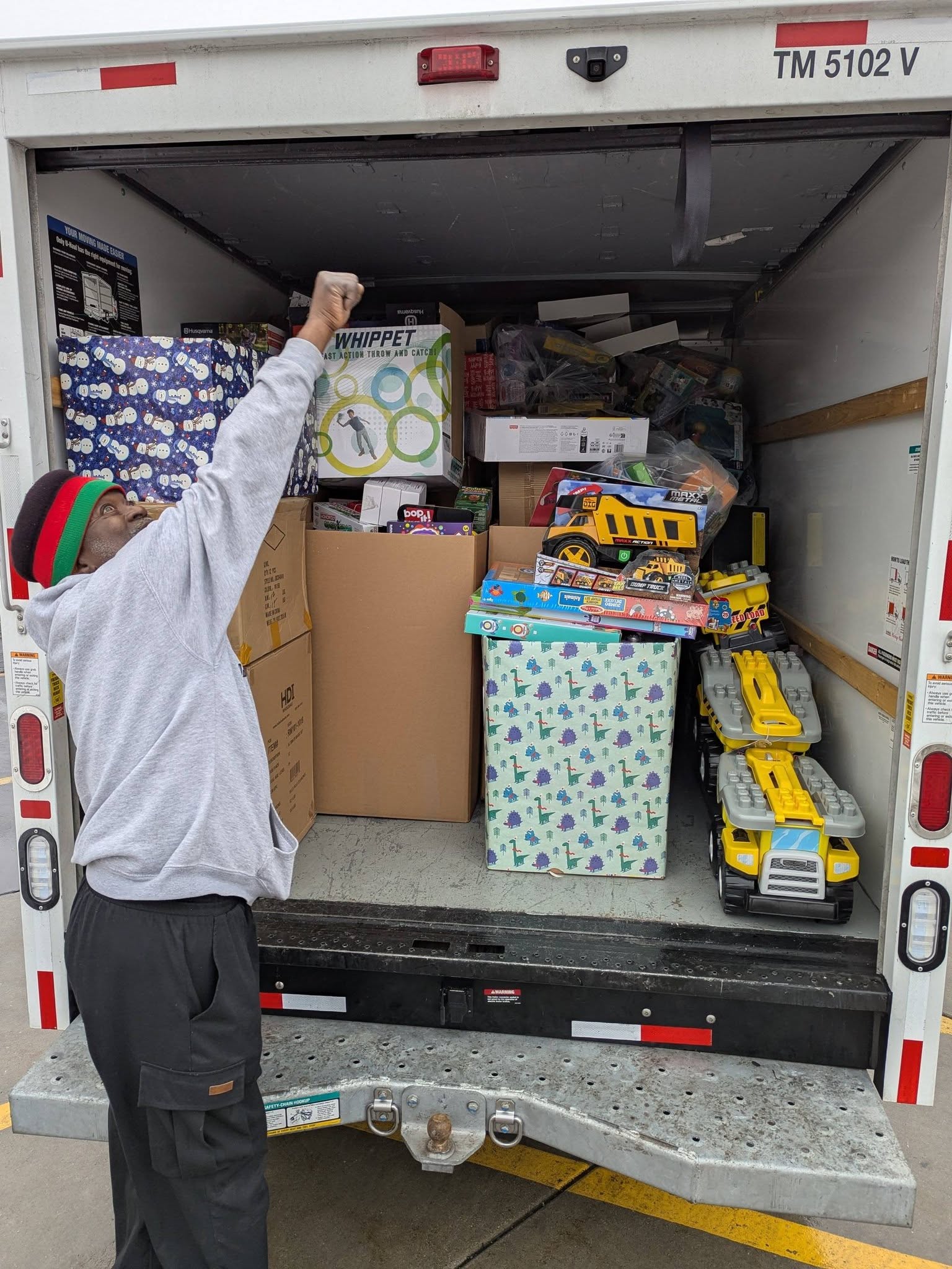 Andre' Lee Ellis with community partner — toy drive
