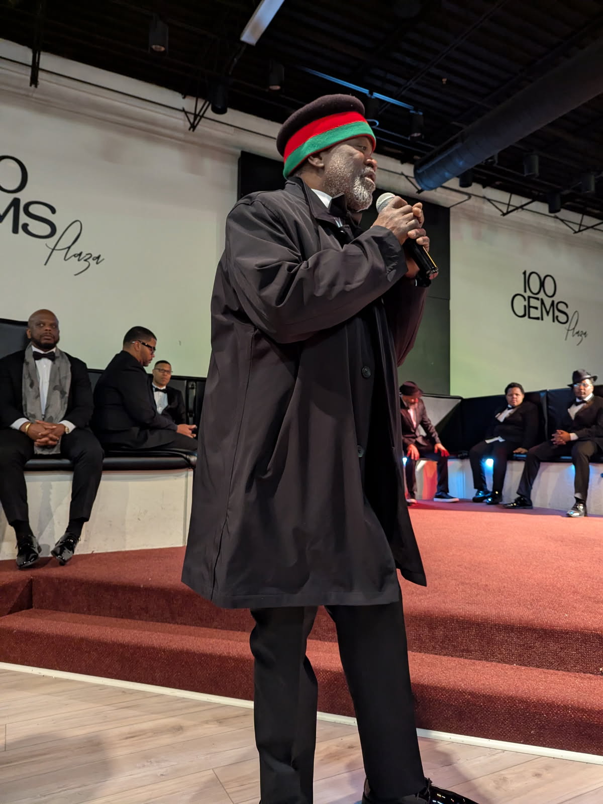 Andre' Lee Ellis speaking on stage