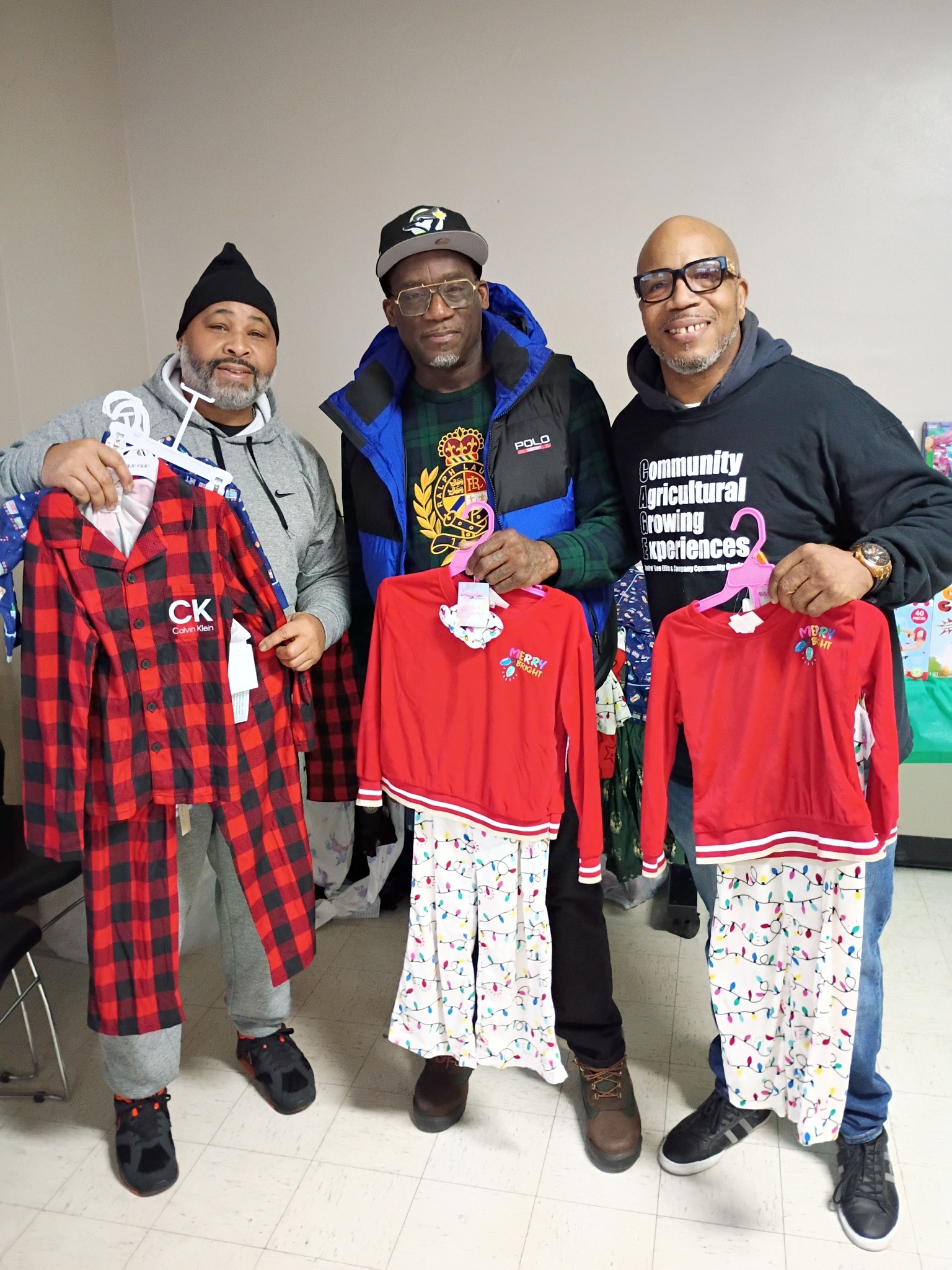 CAGE MKE members with donated kids clothing